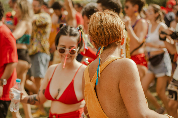 Festival-Season Safe-Sex girls in crowd dancing