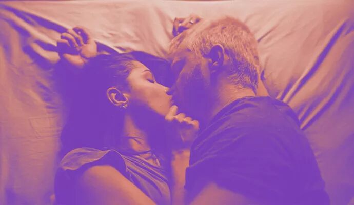 Lube Myths guy and girl laying in bed together