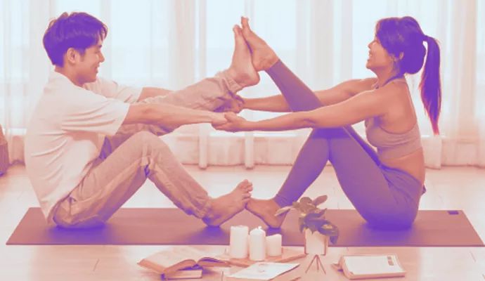 Man and woman on ground yoga.